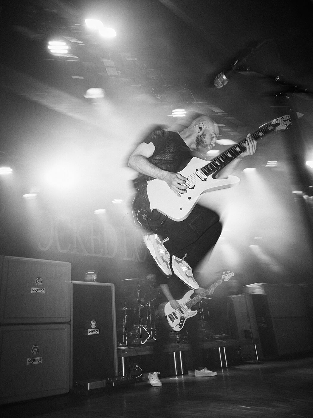 Isaac Hale of Knocked Loose does a jump onstage while performing live
