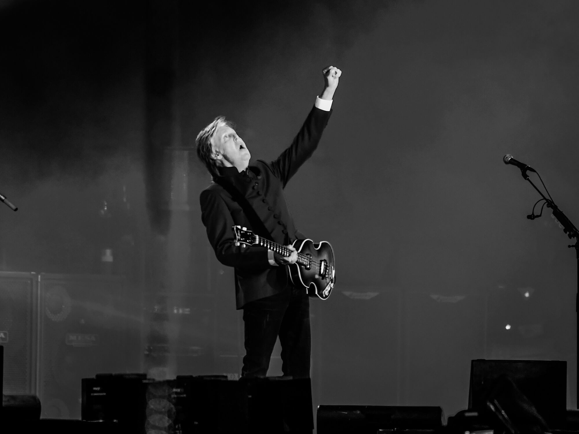 Paul McCartney photographed in black and white on stage at Glastonbury in 2022
