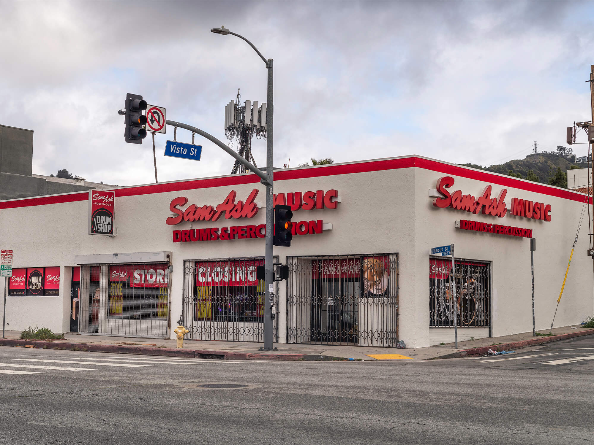 Sam Ash store in LA photographed in April 2024. Signs in the windows read 'store closing'.