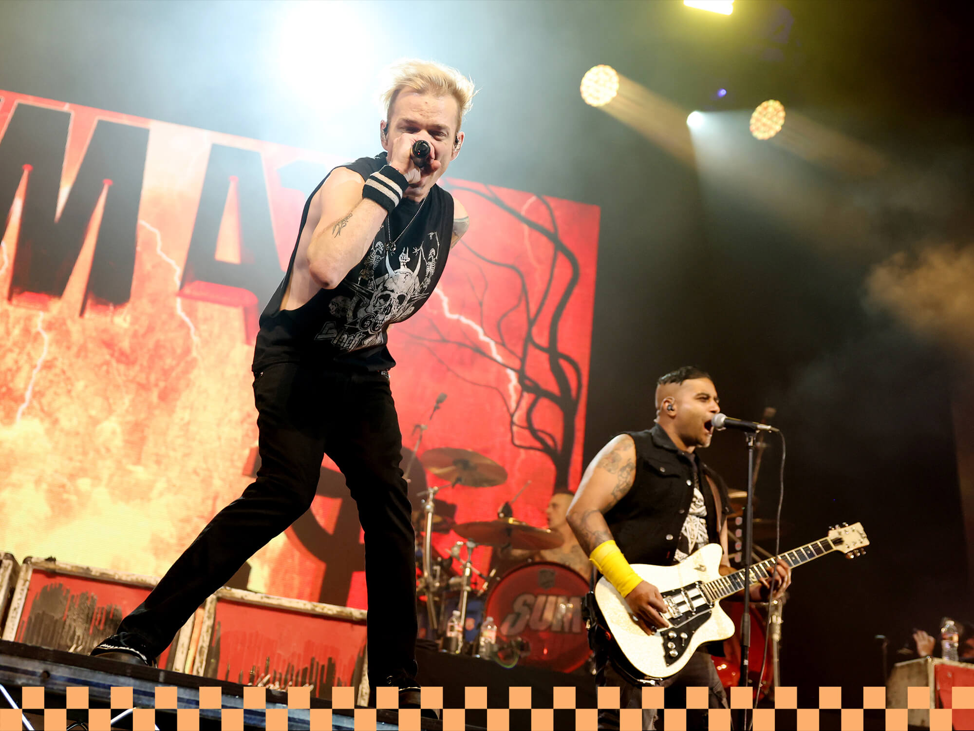 Deryck Whibley and Dave Baksh of Sum 41 performing at iHeartRadio ALTer EGO in 2024, photo by Rich Polk/Getty Images for iHeartRadio