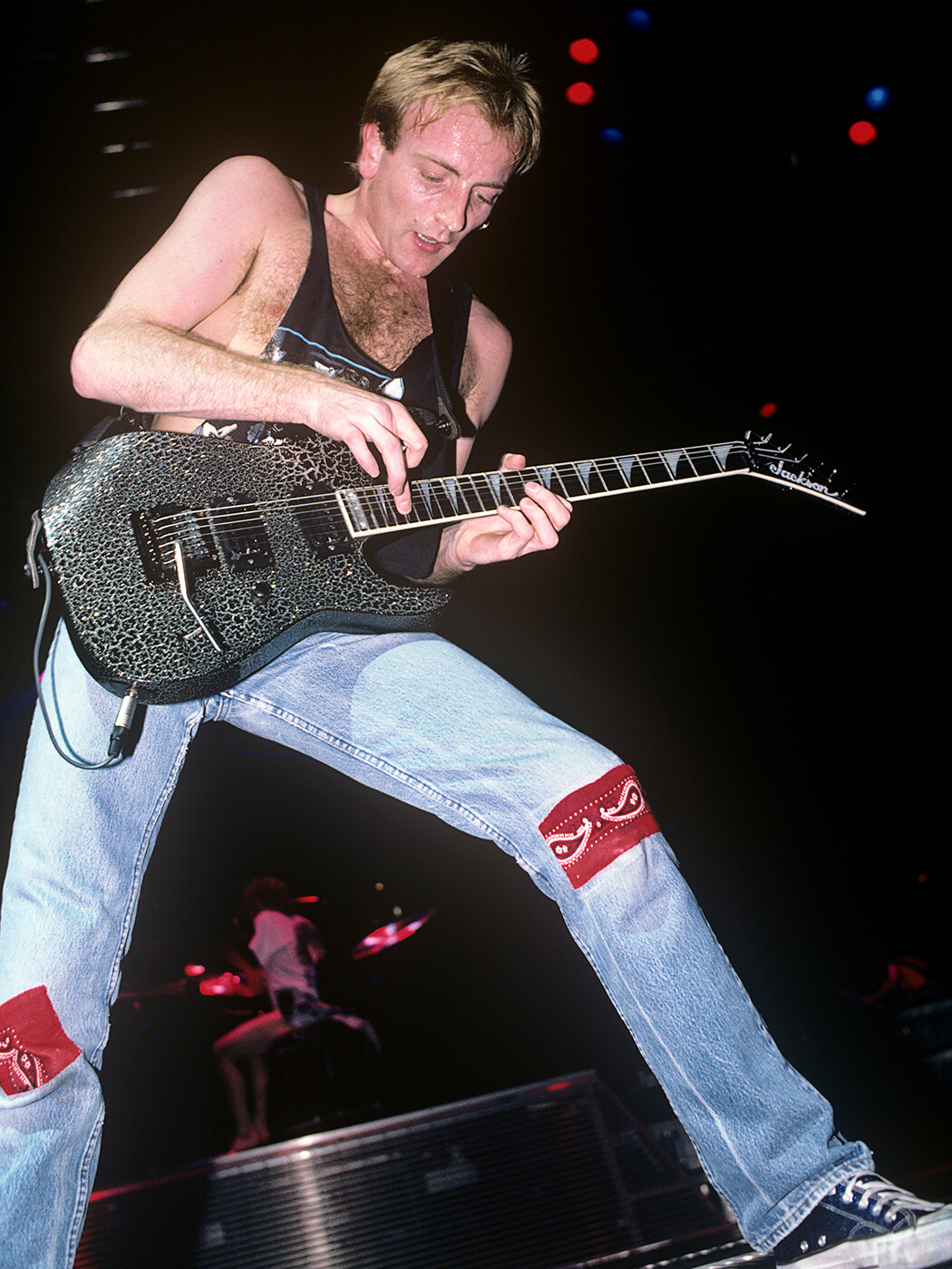 Phil Collen of Def Leppard performing in 1987 with his Jackson guitar with a ‘Cracklejack’ finish, photo by Ebet Roberts/Redferns via Getty Images