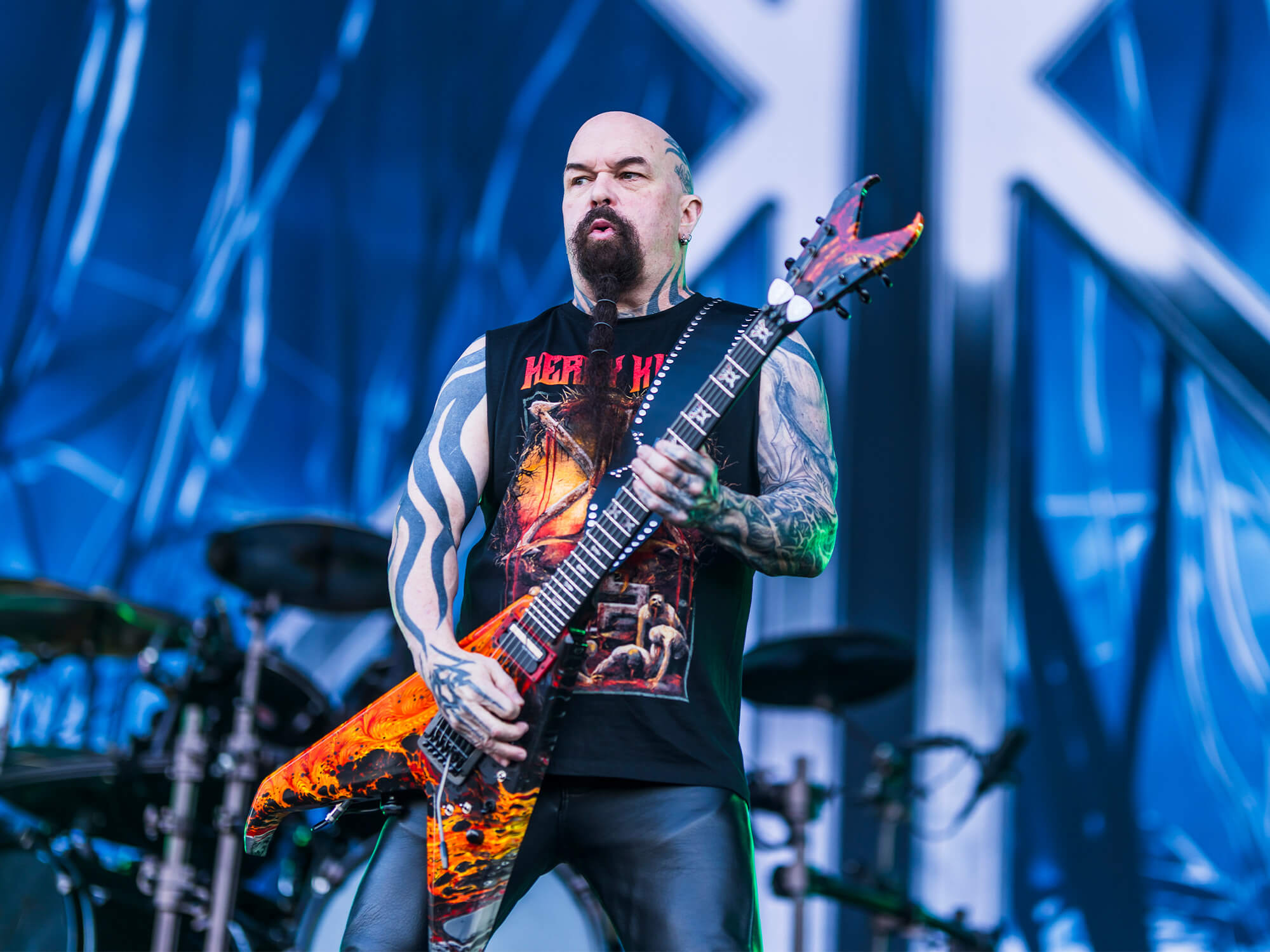 Kerry King photographed playing guitar on stage.